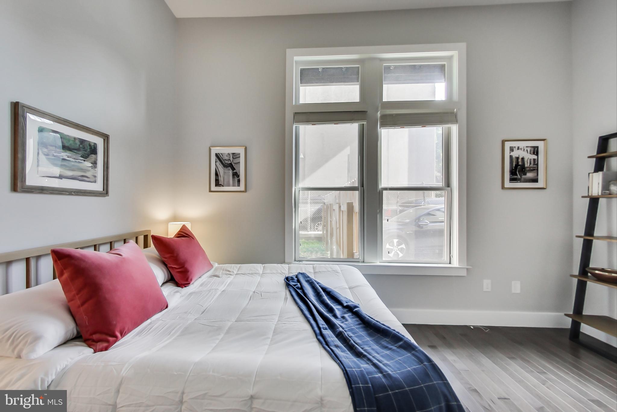 1767 Lanier Place Northwest, Unit 2 Washington, DC 20009 - Photo 8 of 19 a bedroom with a bed and a window