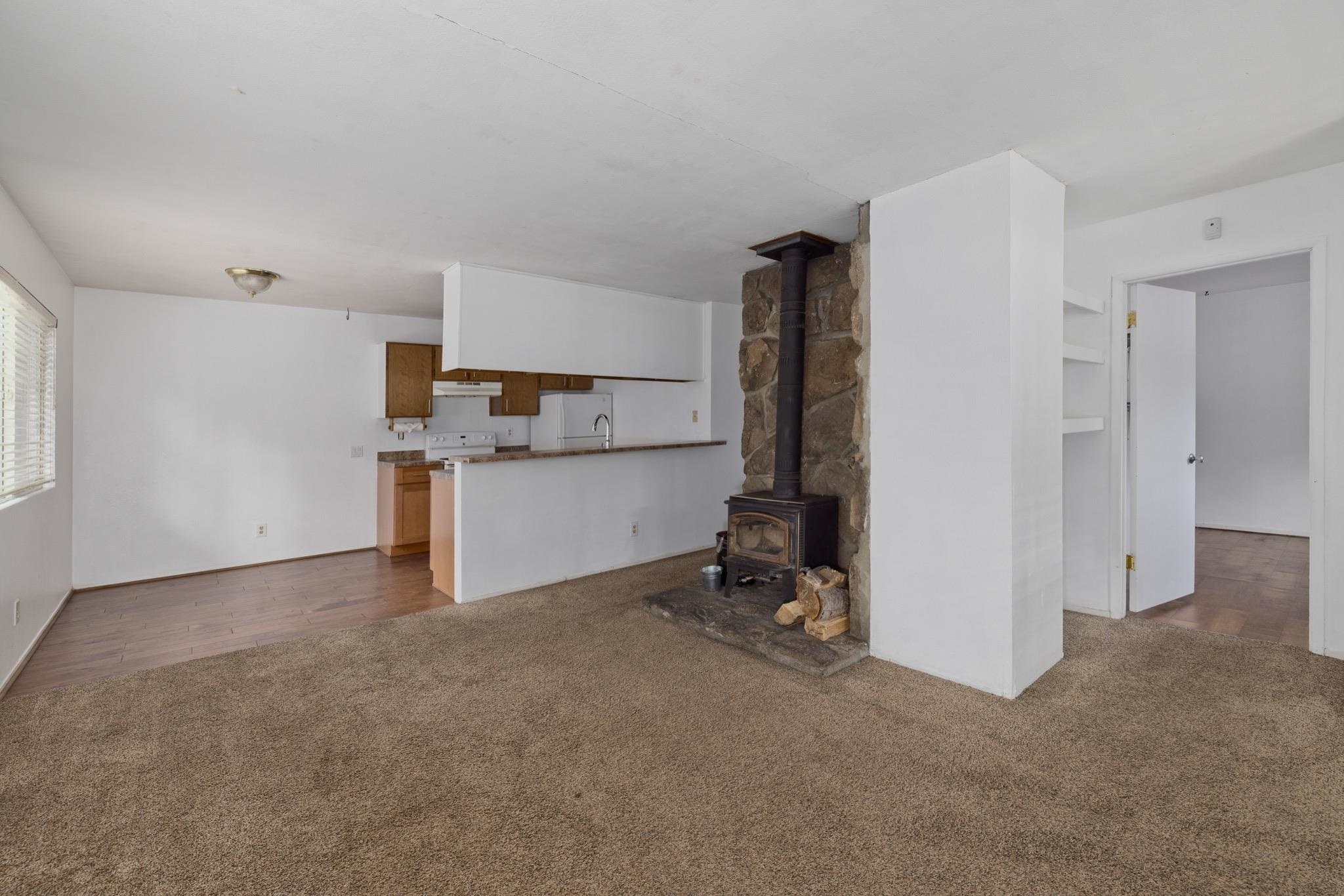 541 Mono Street, Unit 2 Mammoth Lakes, CA 93546 - Photo 6 of 16 a view of a kitchen with a sink cabinets and a window