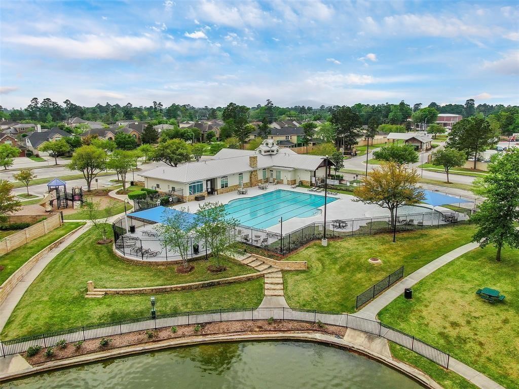 29819 South Legends Village Circle Spring, TX 77386 - Photo 4 of 48 an aerial view of a house with a garden and lake view