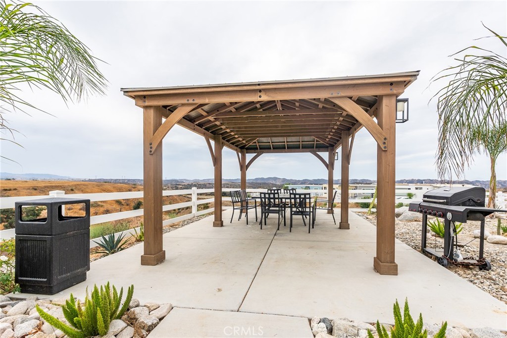 1134 Villa Calimesa Lane, Unit 106 Calimesa, CA 92320 - Photo 20 of 22 a view of outdoor space with seating area and entertaining space
