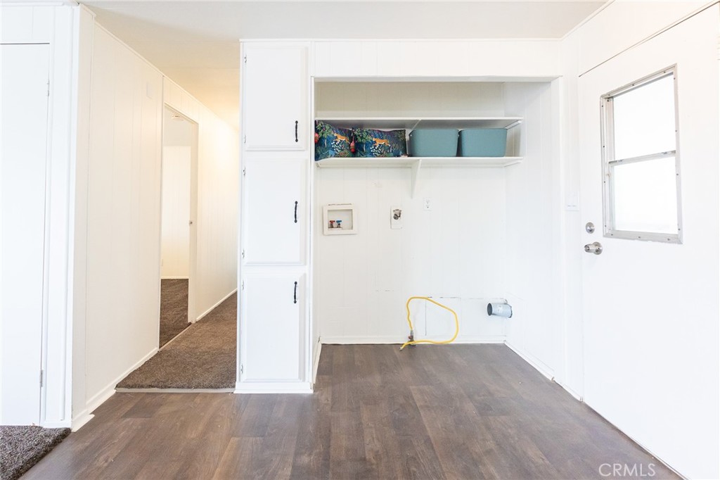 1134 Villa Calimesa Lane, Unit 106 Calimesa, CA 92320 - Photo 6 of 22 a view of a hallway with wooden floor and entryway