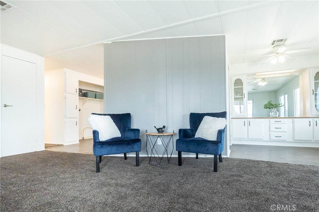 1134 Villa Calimesa Lane, Unit 106 Calimesa, CA 92320 - Photo 8 of 22 a living room with furniture and a table