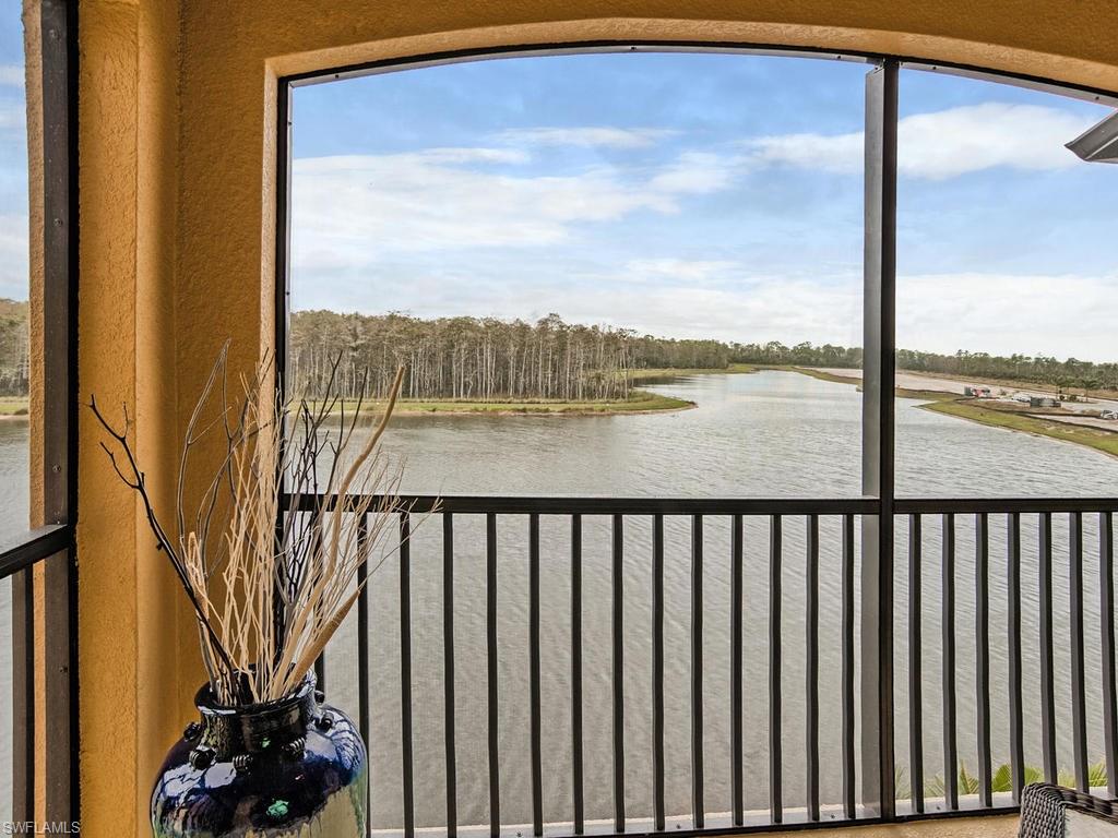 9560 Trevi Court, Unit 4842 Naples, FL 34113 - Photo 15 of 25 a view of a balcony next to a lake view