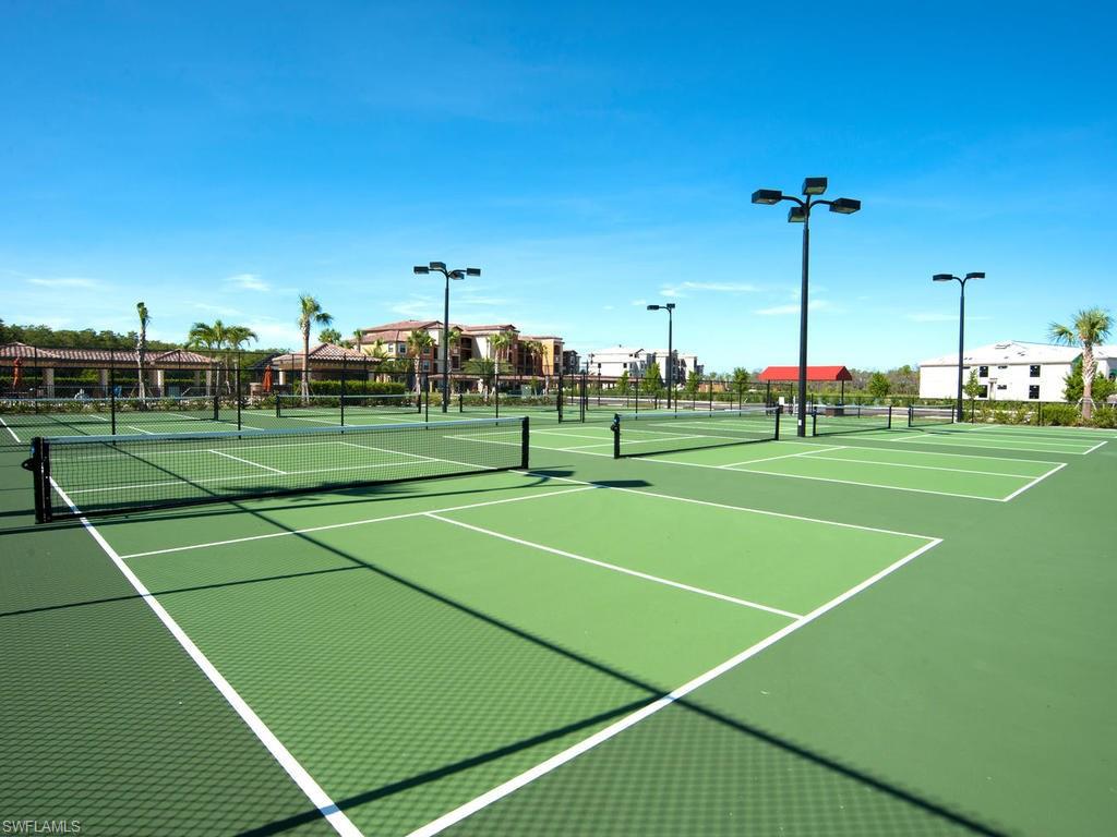 9560 Trevi Court, Unit 4842 Naples, FL 34113 - Photo 22 of 25 a view of a tennis court