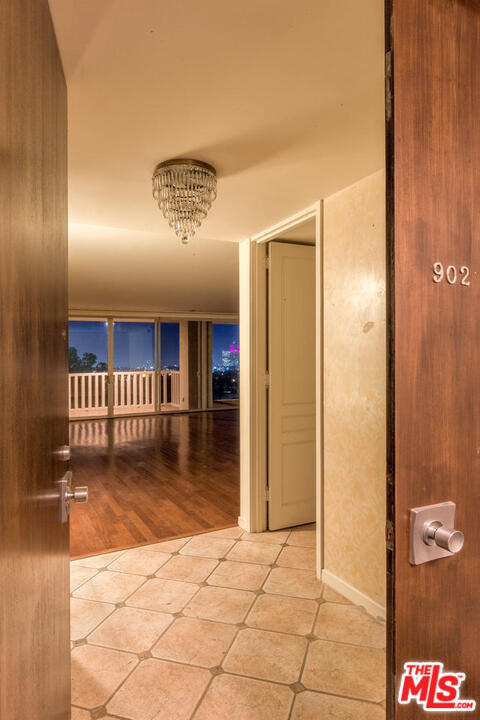 9255 Doheny Road, Unit 902 West Hollywood, CA 90069 - Photo 3 of 47 a view of a hallway with entryway