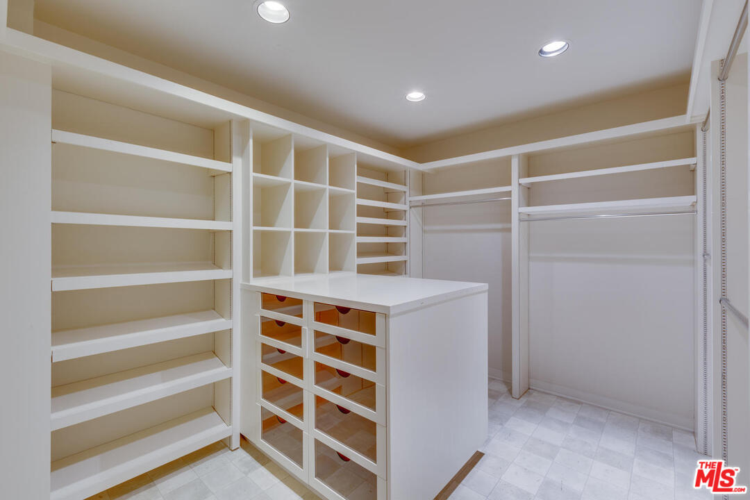 9255 Doheny Road, Unit 902 West Hollywood, CA 90069 - Photo 21 of 47 a view of an empty room with a empty shelves
