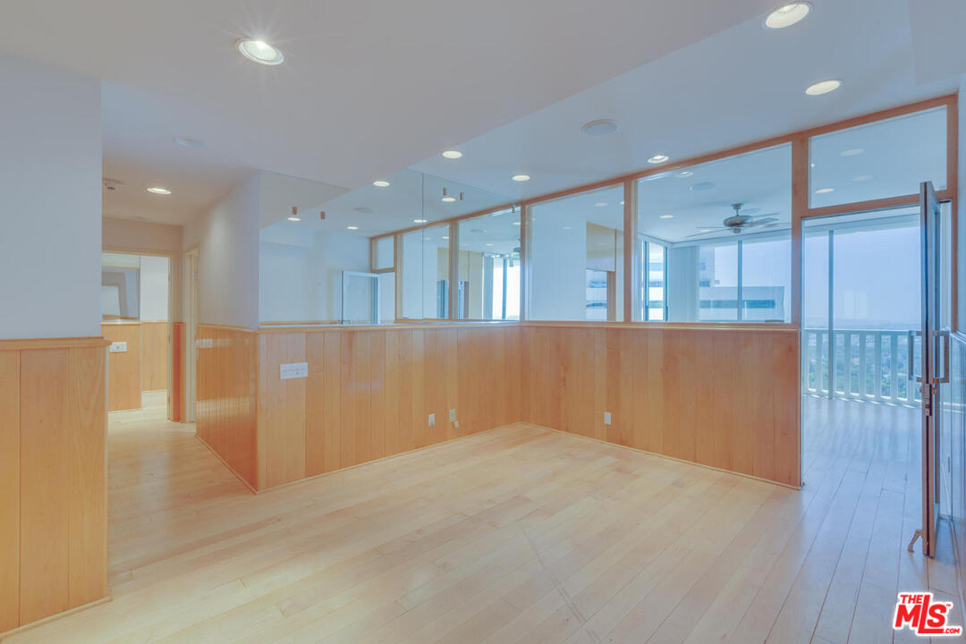 9255 Doheny Road, Unit 902 West Hollywood, CA 90069 - Photo 26 of 47 a view of a kitchen with a refrigerator