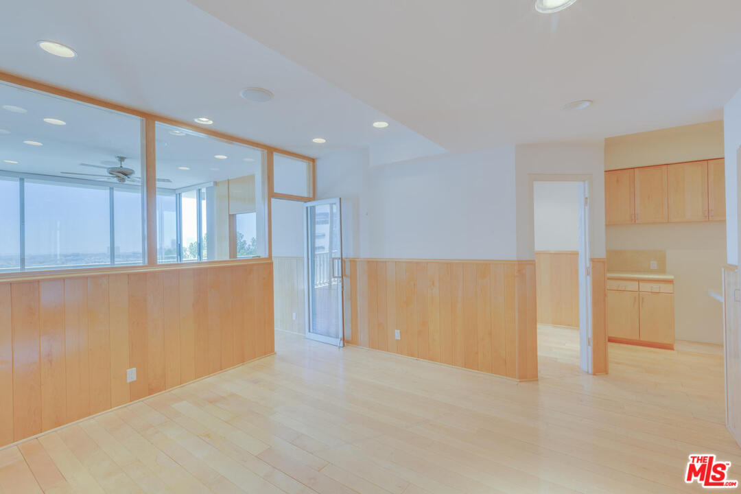 9255 Doheny Road, Unit 902 West Hollywood, CA 90069 - Photo 27 of 47 a view of an empty room with wooden cabinet