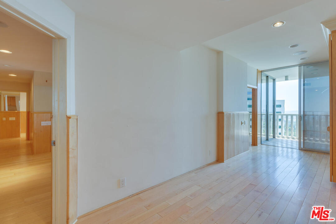 9255 Doheny Road, Unit 902 West Hollywood, CA 90069 - Photo 32 of 47 a view of a hallway with wooden floor