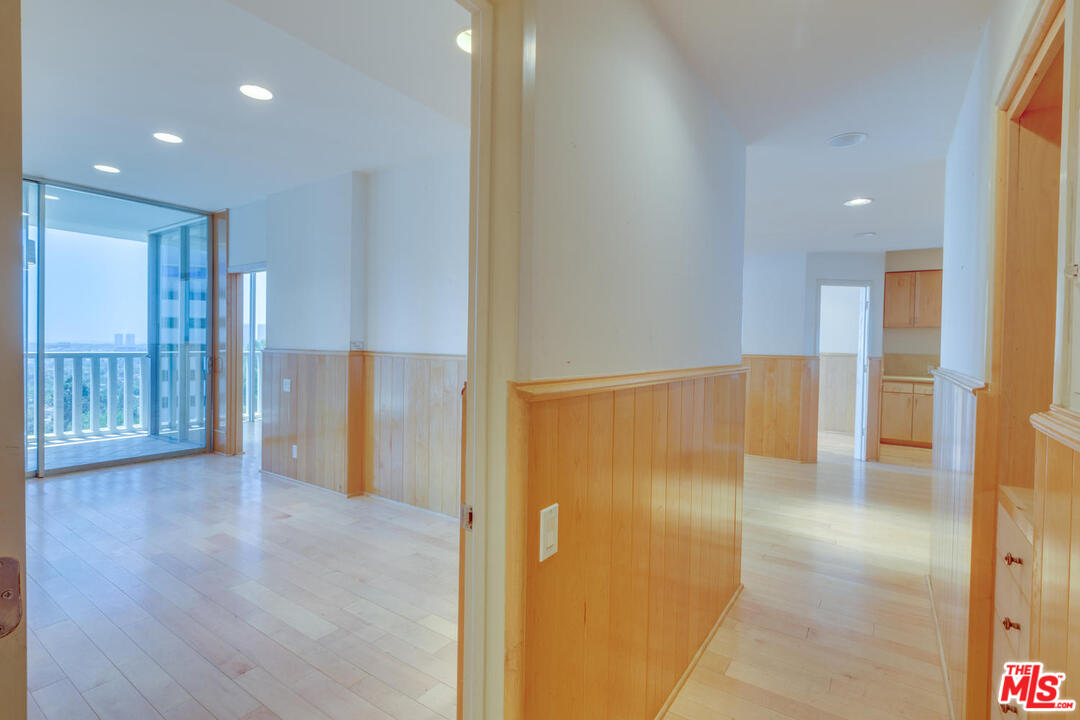 9255 Doheny Road, Unit 902 West Hollywood, CA 90069 - Photo 35 of 47 a view of a hallway with wooden floor