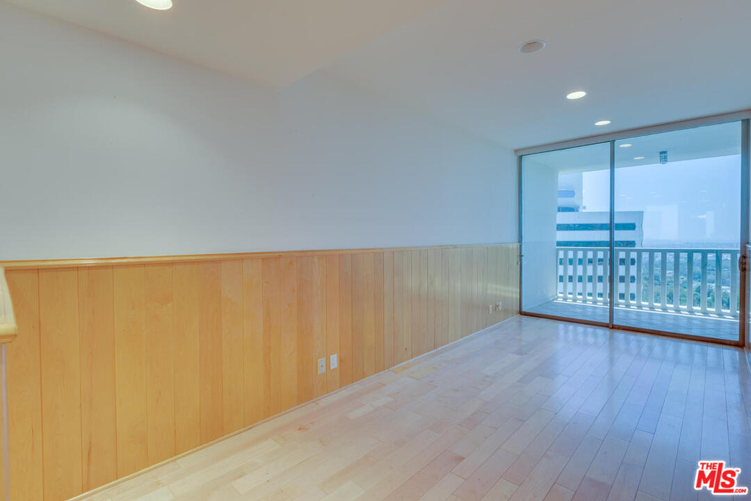 9255 Doheny Road, Unit 902 West Hollywood, CA 90069 - Photo 38 of 47 a view of an empty room with wooden floor