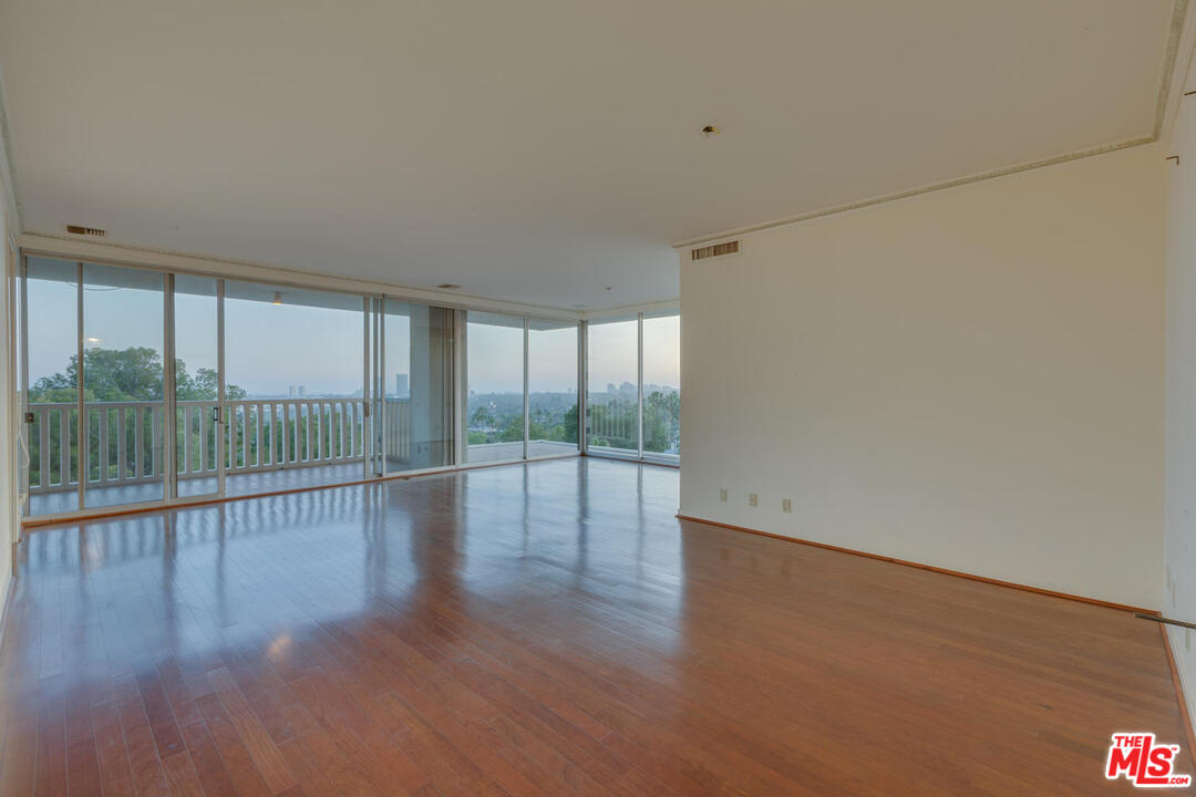 9255 Doheny Road, Unit 902 West Hollywood, CA 90069 - Photo 39 of 47 a view of empty room with wooden floor