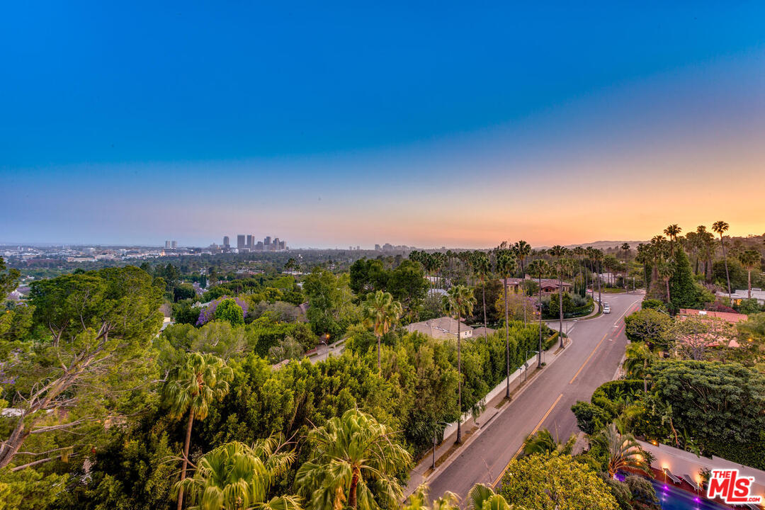 9255 Doheny Road, Unit 902 West Hollywood, CA 90069 - Photo 46 of 47 a view of a city with lush green forest