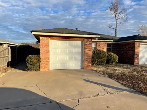 a view of a backyard of the house