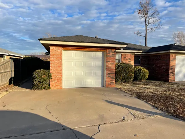 a view of a backyard of the house