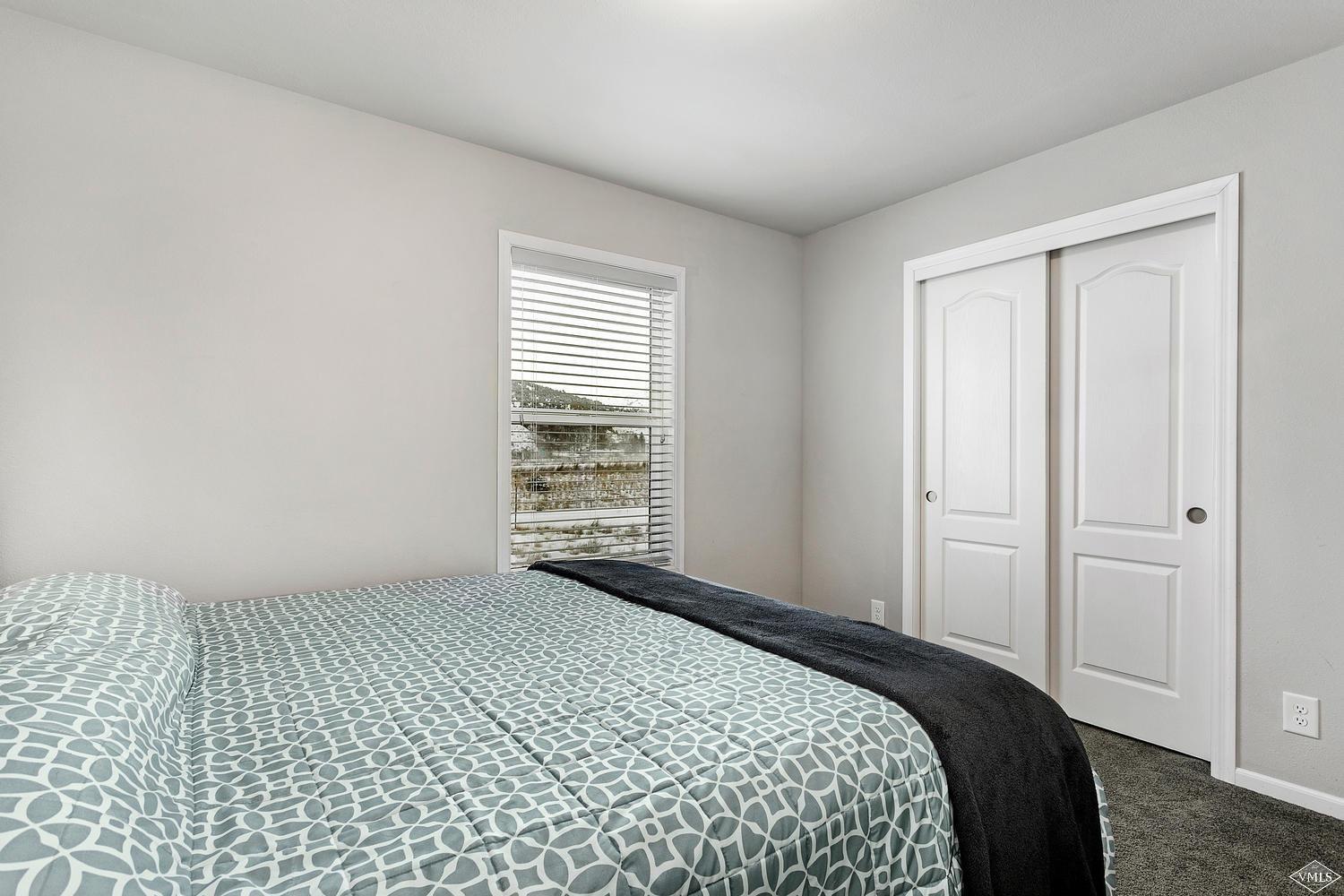 80 Salmon Loop Gypsum, CO 81637 - Photo 13 of 18 a bedroom with a bed and a window