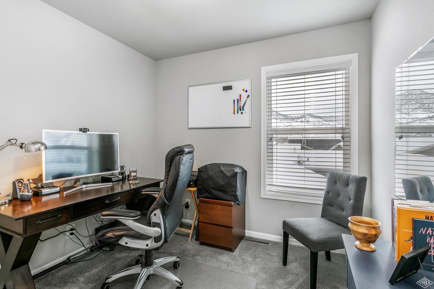 80 Salmon Loop Gypsum, CO 81637 - Photo 10 of 18 a view of a workspace with furniture and a window