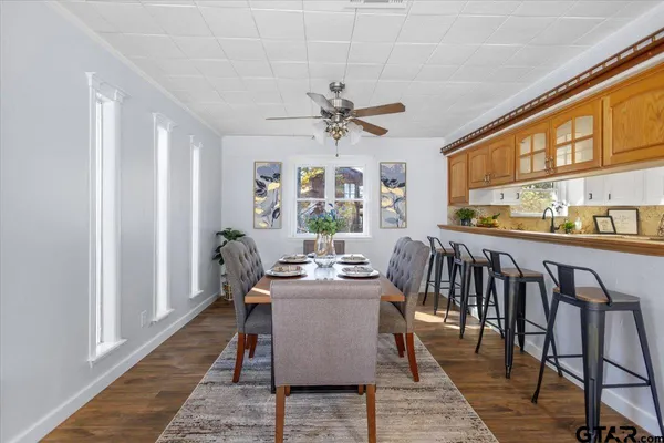 a living room with furniture or kitchen view and a wooden floor