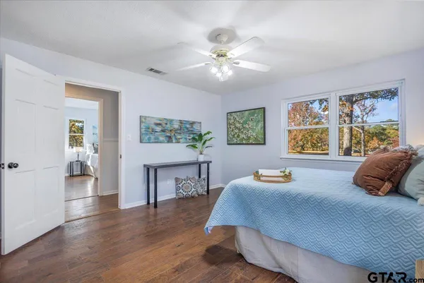a bathroom with a double vanity sink mirror and toilet