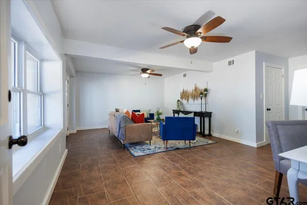 a living room with furniture and a window
