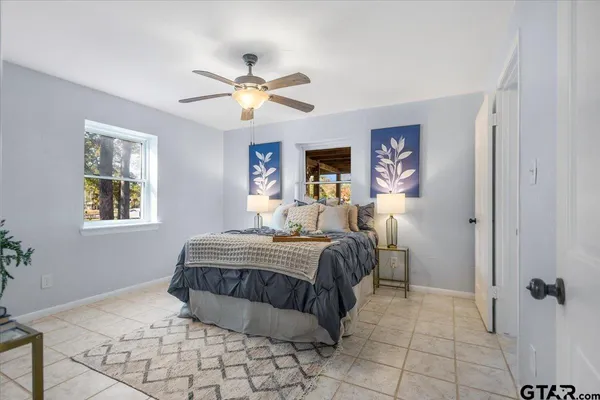 a bathroom with a sink mirror and vanity
