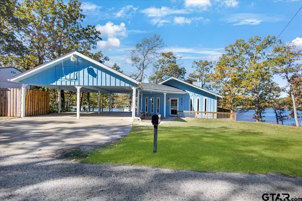 a view of a park with large trees