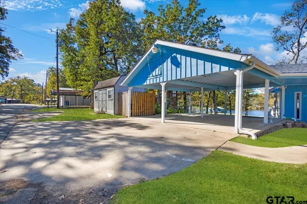 a view of a lake with a yard