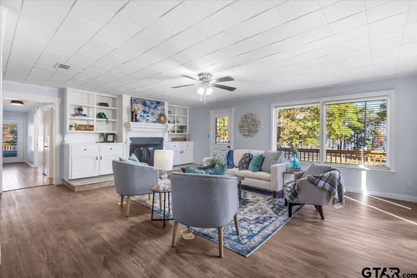 a living room with furniture and a large window