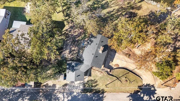 an aerial view of residential building with outdoor space and lake view