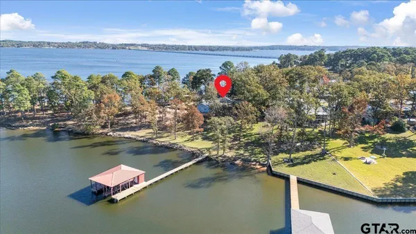 a dining room with furniture a rug and wooden floor