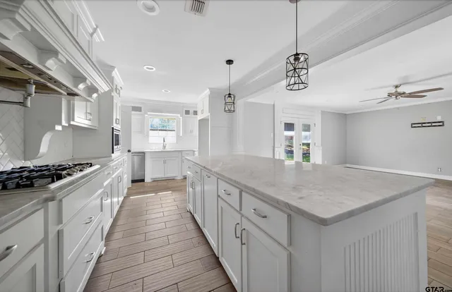 a kitchen with a stove and a sink