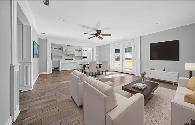 a living room with furniture and a flat screen tv