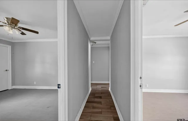 a view of a hallway with a white walls