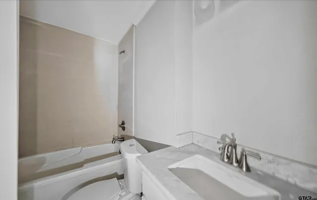 a bathroom with a sink and a toilet
