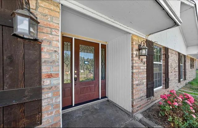 a view of a potted plant in front of a building