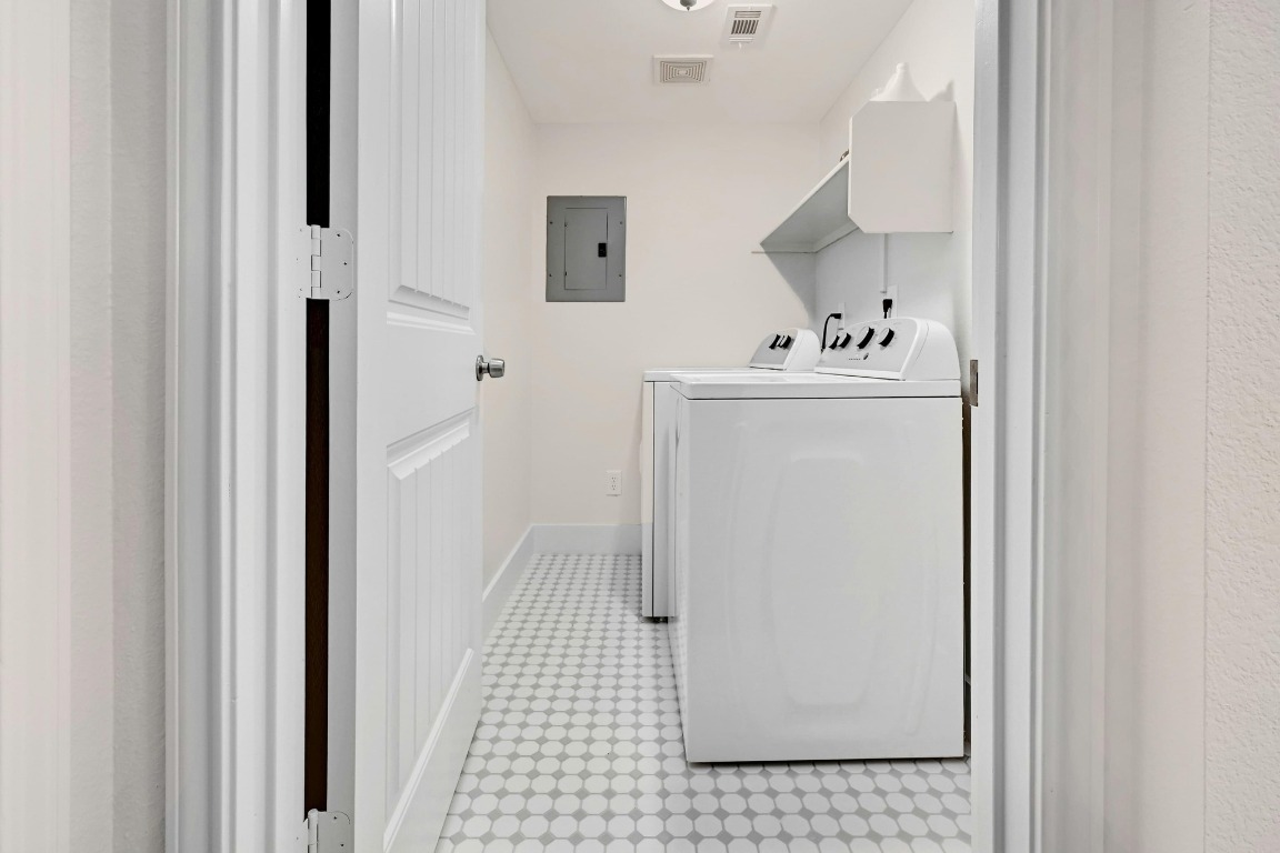 1307 Norwalk Lane, Unit 104 Austin, TX 78703 - Photo 17 of 22 a bathroom with a sink and a mirror
