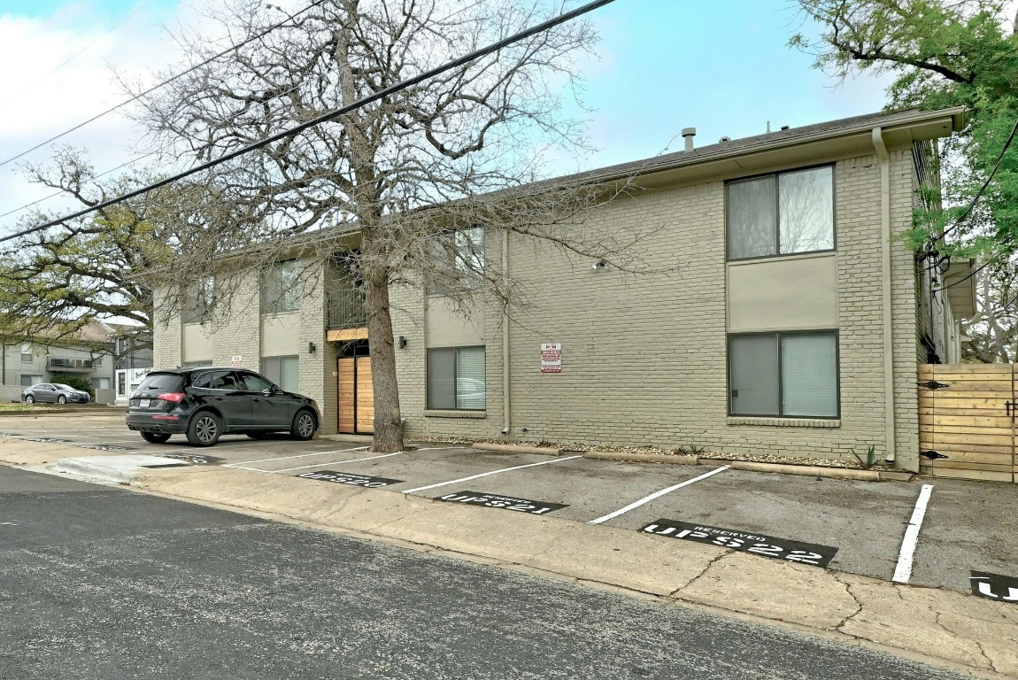 1307 Norwalk Lane, Unit 104 Austin, TX 78703 - Photo 19 of 22 a view of a car parked in front of a house