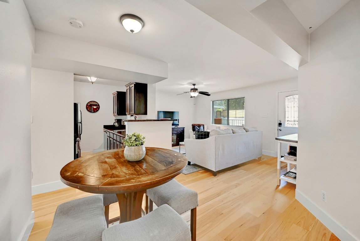 1307 Norwalk Lane, Unit 104 Austin, TX 78703 - Photo 8 of 22 a living room with furniture and a table
