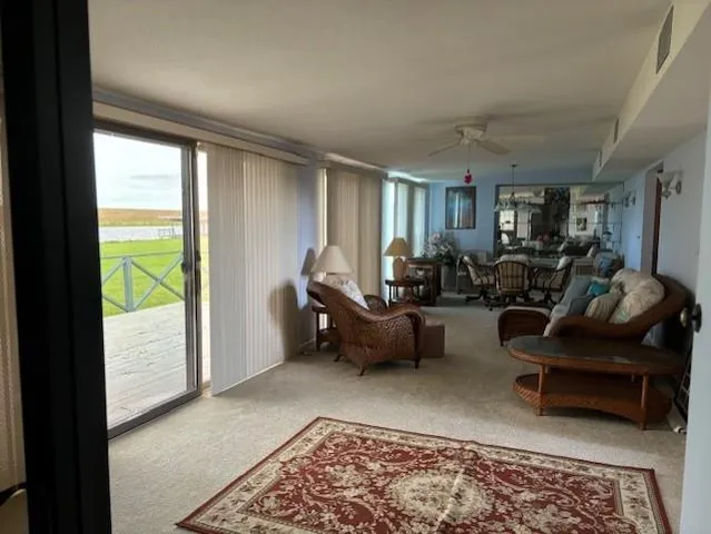 a living room with furniture and a rug