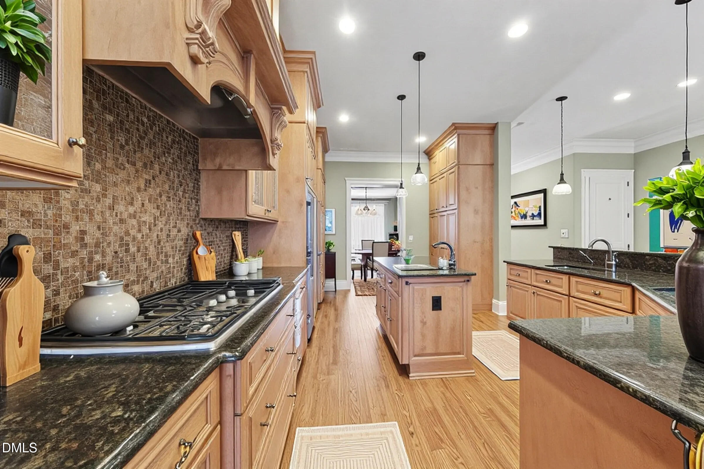 4105 Gardenlake Drive Raleigh, NC 27612 - Photo 10 of 28 a kitchen with stainless steel appliances granite countertop a stove a sink dishwasher and a refrigerator