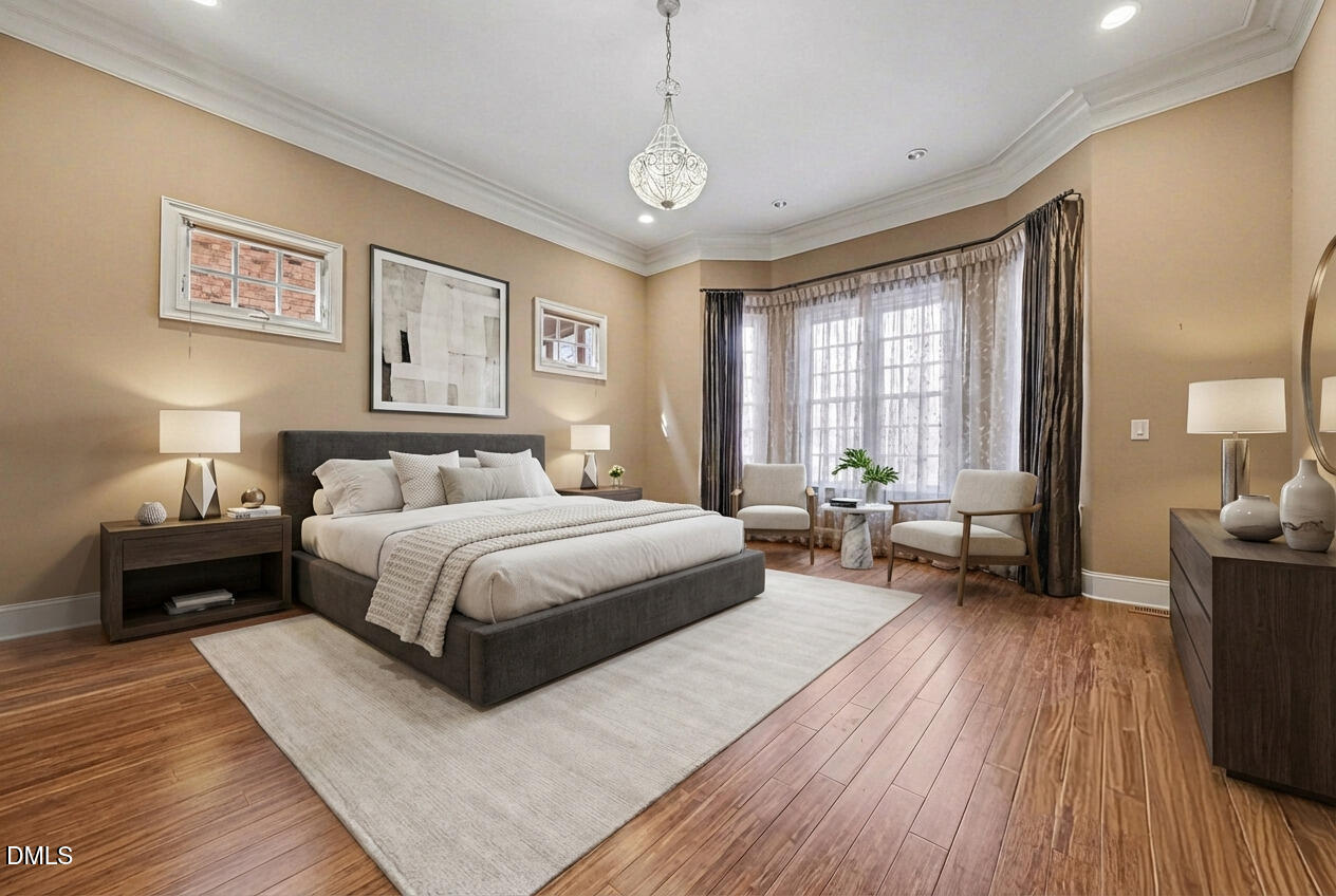 4105 Gardenlake Drive Raleigh, NC 27612 - Photo 14 of 28 a spacious bedroom with a bed couch and a window