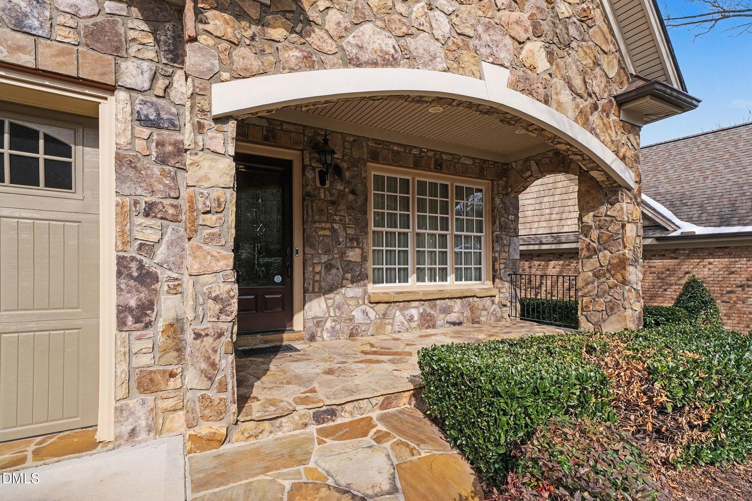 4105 Gardenlake Drive Raleigh, NC 27612 - Photo 2 of 28 a front view of a house with garden