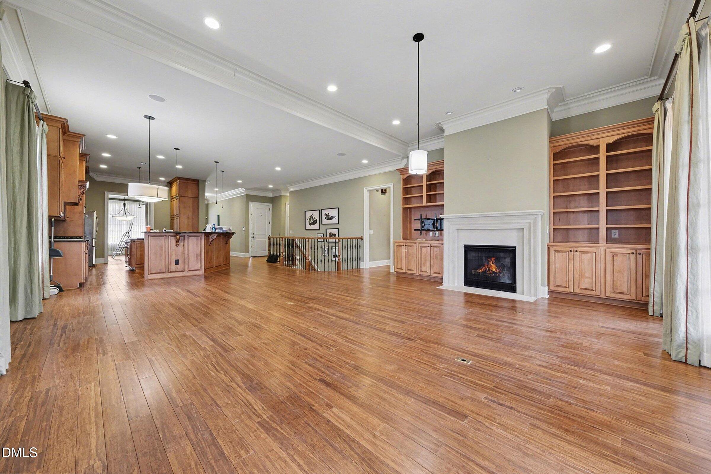 4105 Gardenlake Drive Raleigh, NC 27612 - Photo 5 of 28 a view of livingroom with furniture wooden floor and fireplace