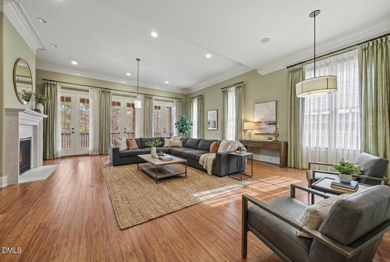 4105 Gardenlake Drive Raleigh, NC 27612 - Photo 6 of 28 a living room with furniture and wooden floor