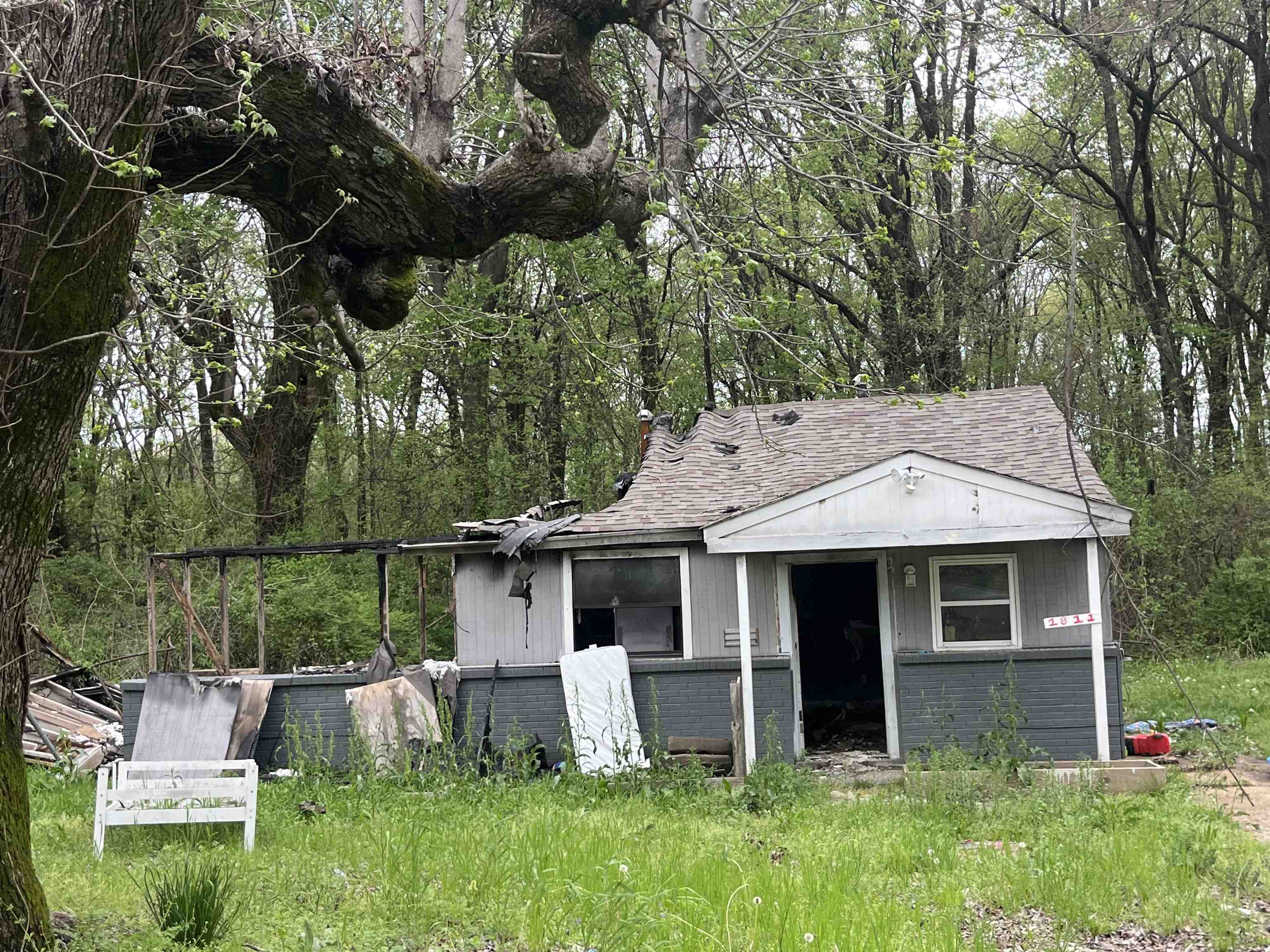 1811 Rozelle Street Memphis, TN 38106 - Photo 3 of 3 View of front of property with a shingled roof and an outbuilding