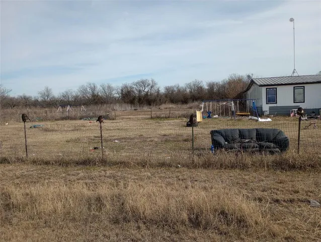 a view of a yard with an outdoor space