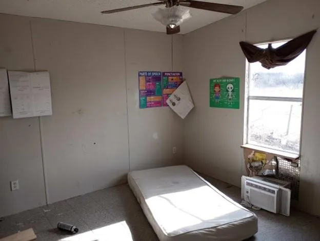 a view of a livingroom with furniture and a window