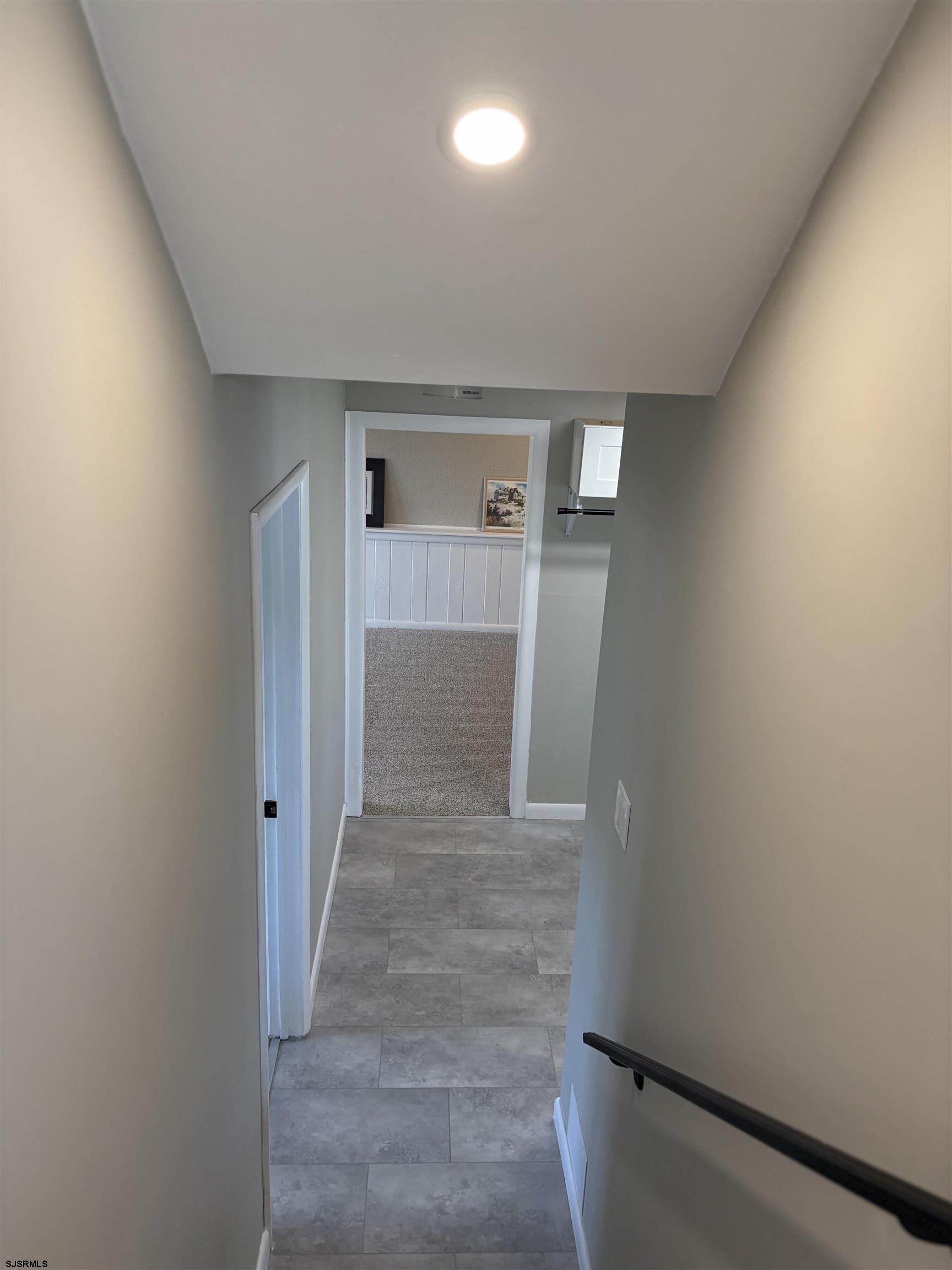 31 Gulph Mill Road Somers Point, NJ 08244 - Photo 16 of 32 wooden floor in a hall with wooden cabinet