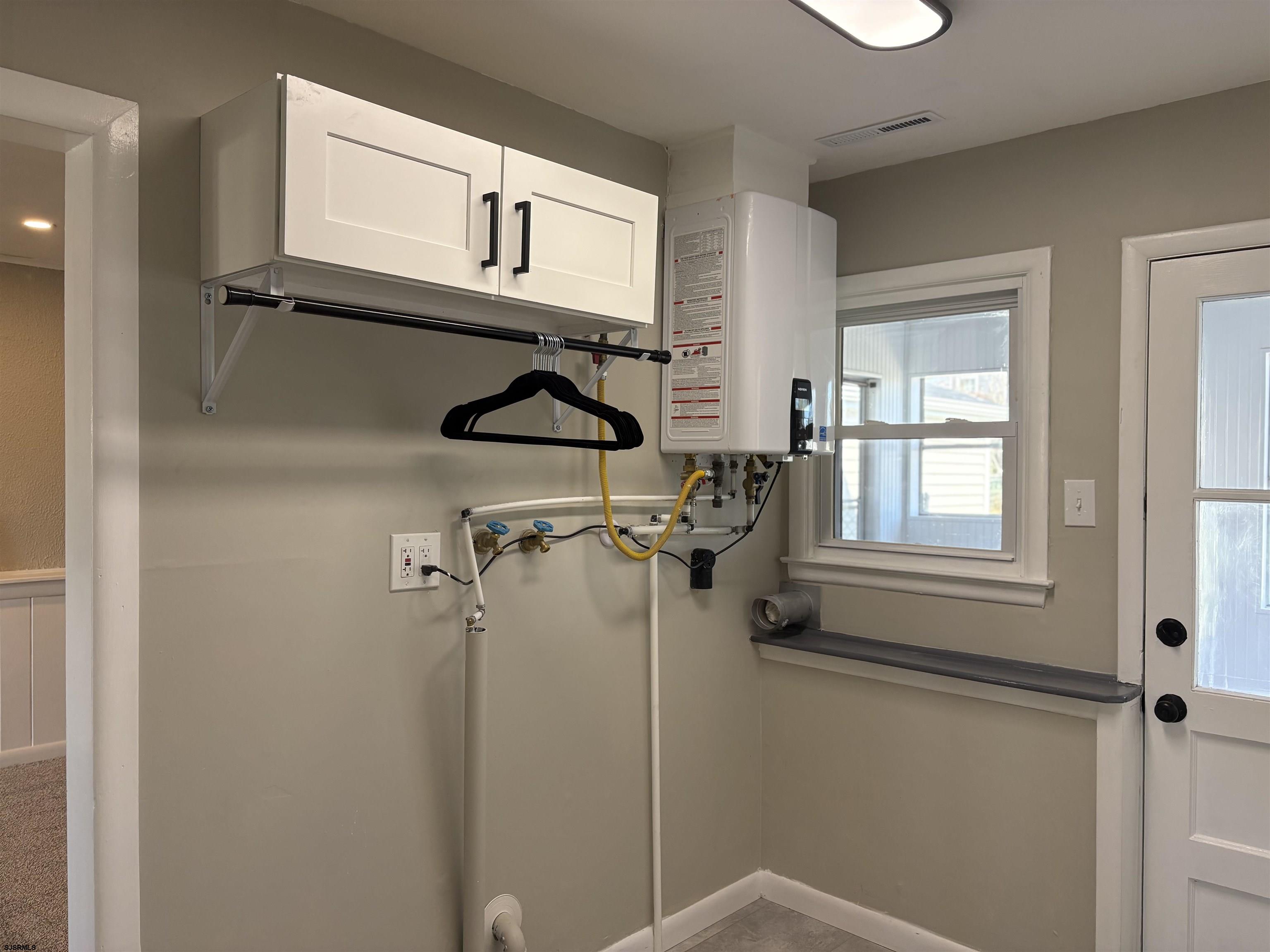 31 Gulph Mill Road Somers Point, NJ 08244 - Photo 17 of 32 a bathroom with a shower and a window