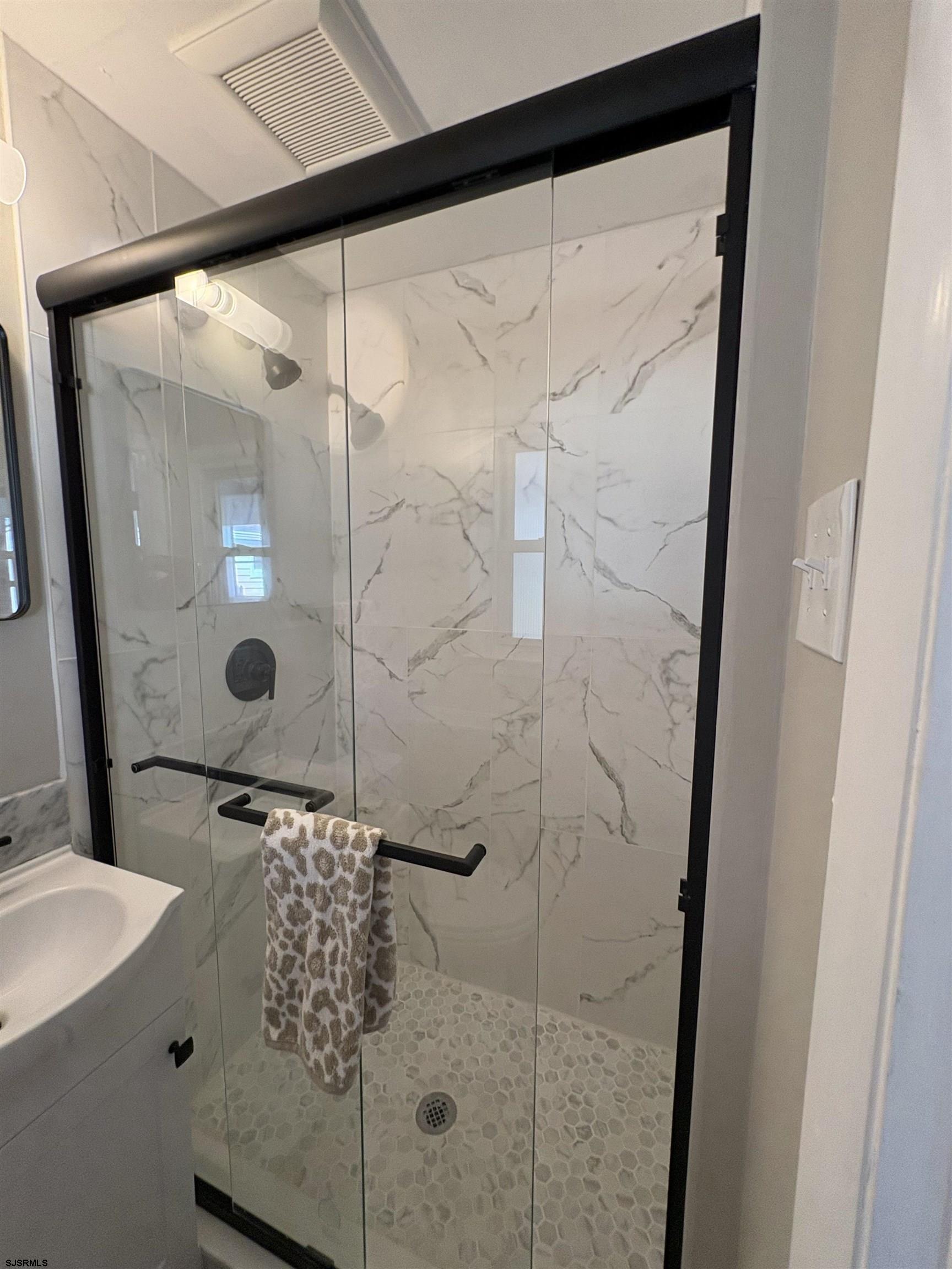 31 Gulph Mill Road Somers Point, NJ 08244 - Photo 25 of 32 a bathroom with a shower and a sink